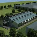 Modern Industrial Factory Building With Glass Roof And Walls In Green Area Surrounded By Trees