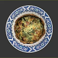 Golden Crust Spinach And Cheese Quiche On Blue White Patterned Plate