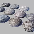Multiple Circular Decorative Plates With Intricate Engraved Patterns Arranged Together