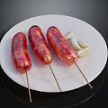 Grilled Sausages on Skewers Served on White Plate With Garlic Cloves