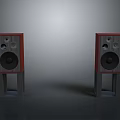 Electronic Audio Speakers With Red Wooden Enclosure Black Drivers And Gray Stands Against Gray Background