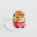 Delicious Cupcake With Cream Frosting Caramel Drizzle And Almond Toppings On White Plate