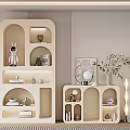 Modern Light Colored Decorative Cabinet With Various Shaped Shelves And Decorative Items