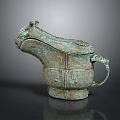 Ancient Bronze Household Utensil With Animal Head Design And Intricate Patterns