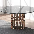 Round Coffee Table With Black Marble Top And Copper Geometric Base On Grey Rug