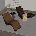 Modern Brown Black Loungers With Small Round Table Vase Plant Yellow Blanket On Indoor Rug