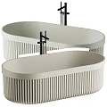 Two Modern Neutral Ribbed Freestanding Bathtubs With Black Faucets And Elegant Design