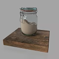 Glass Jar With Sand On Wooden Board For Sculpture Carving