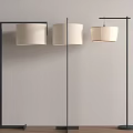 Modern Floor Lamps With Black Metal Frames And Cream Fabric Shades