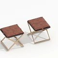 Two Modern Minimalist Stools With Brown Upholstered Seats And Cross Metal Legs