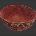 Intricately Carved Bowl With Golden Floral Patterns And Rich Red Interior
