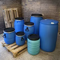 Durable Industrial Equipment Blue Plastic Drums with Black Lids in Various Sizes on Wooden Pallets