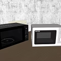 Modern Black And White Microwaves As Stylish Kitchen Appliances On Wooden Countertop