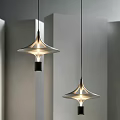 Modern Pendant Lights With Unique Metallic Shade And Warm Illumination In Minimalist Interior