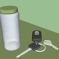 Transparent Glass Jar With Green Lid And Liquid Next To Car Keys