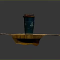Green Coffee Cup With Brown Lid On Wooden Table Surface