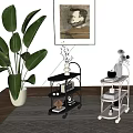 Black and Silver Rolling Storage Carts With Decorative Items In Indoor Living Space