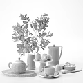 Tea Set with Black Teapot Coffee Pot Green Apples and Sugar Cubes on Table