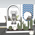 Outdoor Feature Wall With Blue White Checkered Pattern Circular Mirror Cacti And Green Plants