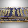 Antique Ornate Decorative Box Featuring Intricate Golden Figure Reliefs On Blue Background