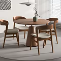 Modern Minimalist Round Wooden Dining Table With Four Chairs Green Plant And Pendant Light