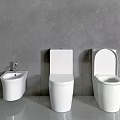 Modern Bathroom Interior With Three White Toilets And Sink Against Grey Tile Walls