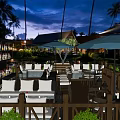 Outdoor Restaurant With Palm Trees Wooden Deck And Comfortable Sofa Seats