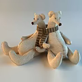 Two Beige Fabric Stuffed Bear Toys With Striped Scarves In Sitting Posture
