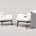 Modern White Single Sofa With Black Legs And Black And White Checkered Blanket
