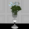 Clear Glass Vase With White Daisies Green Leaves On White Pedestal Against Light Paneled Wall