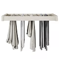Light Colored Clothes on White Wall Mounted Hanger with Long Sleeve Tops and Pants
