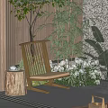 Wooden Leisure Chair With Stump Side Table Surrounded By Green Plants White Flowers And Bamboo