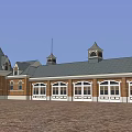 Classic Traditional Red Brick Building With Steeply Pitched Roof And Multiple Windows
