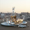 Crystal Liquor Decanter And Glasses On Tray At Outdoor Terrace