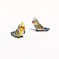 Two Colorful Parrot Figurines With Yellow Blue Feathers As Decorative Ornaments