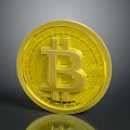 Gold Bitcoin Coin With BTC Symbol And Engraved Text On Shiny Surface