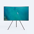Sleek Television Displaying Blue Ocean View with Small Boat on Tripod Stand Against White Background