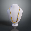 Yellow Beaded Necklace With Black Accents On White Mannequin