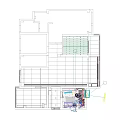 Modern Home Office Workspace With Ergonomic Chair Computer Desk Green Plant And Checkered Rug