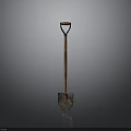 Vintage Shovel With Wooden Handle And Metal Blade On Dark Background