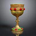 Ornate Golden Wine Goblet With Red Green Gemstones And Intricate Carved Design