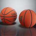 Orange Basketballs With Black Stripes Spalding And NBA Logos On Reflective Surface