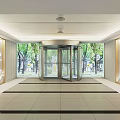 Modern Front Desk Reception Lobby With Revolving Door Green Trees Outside And Mountain Wall Decor