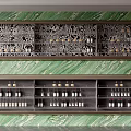 Elegant Wine Cabinet With Intricate Carving And Green Marble Backdrop Storing Wine Bottles And Glasses