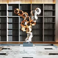 Modern Geometric Metal Sculpture With Abstract Shapes In Interior Bookshelf Space