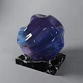 Abstract Colorful Sculpture Carving With Purple Blue Gradient Irregular Flowing Texture On Black Marble Base