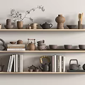 Various Tea Sets Displayed On Wooden Shelves With Teapots Teacups Books And Decorative Plants