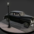 Vintage Black Classic Car Display With Street Lamp On Circular Wet Paved Ground