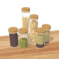 Clear Glass Jars with Cork Lids Holding Dried Beans and Noodles on Wooden Table