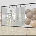 Stylish Window Showcase With Decorative Umbrellas Bamboo Plants And White Pebbles